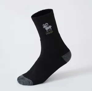 Detailed close-up of a black winter thermal loop sock featuring a knitted sheep pattern.