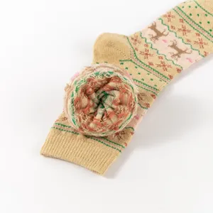 Close-up detail of the cozy winter thermal sock with classic elk and snowflake patterns.