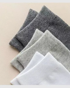 Men's solid mid-calf cotton socks, breathable and comfortable casual knit socks for daily wear.