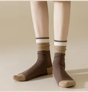 Detail view of women autumn winter mid tube socks ribbed knit Maillard color block design