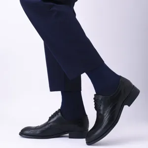 Men's breathable mid-calf dress socks detail view showing fabric texture and classy fit style.