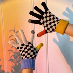 Women winter warm knitted touchscreen gloves with chic checkerboard pattern and colorful cuffs.