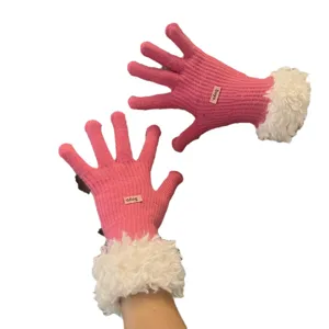 Women winter pink knitted touchscreen gloves featuring cozy fluffy white plush cuffs.