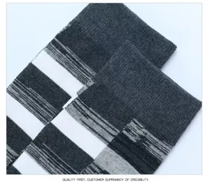 Detail view of men's retro striped color block crew socks in grey, black, and white.