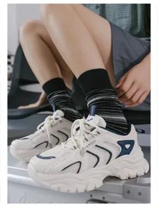 Comfortable striped mid-tube socks for women and men, trendy breathable casual wear.