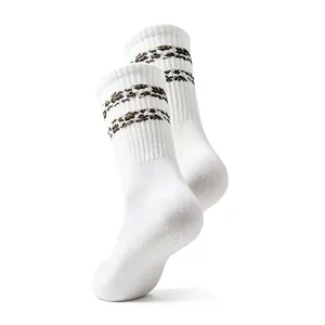 Detailed close-up shot of white crew socks featuring stylish leopard print striped cuffs.