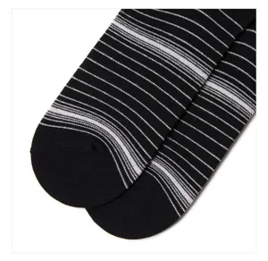 Close-up detail of black and white striped socks, comfortable breathable knitwear design.