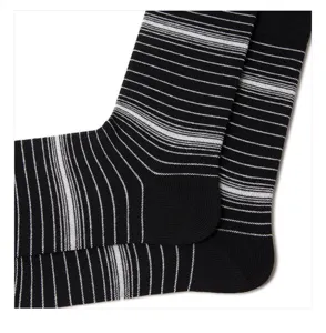 Close-up of black and white striped knit socks, breathable and comfortable daily wear detail.