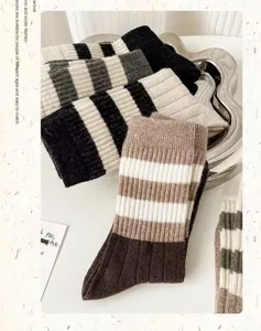 Detail shot of striped mid-tube socks in autumn winter style, comfortable cotton texture.