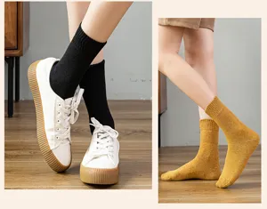 Thick solid color mid-calf cotton socks detail showcasing comfortable wear and warm design.