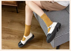 Thickened terry mid-calf socks detail showing comfortable fit and warm texture in daily wear.