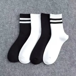 Unisex casual mid-tube socks with classic double stripes, black and white cotton college style pairs.