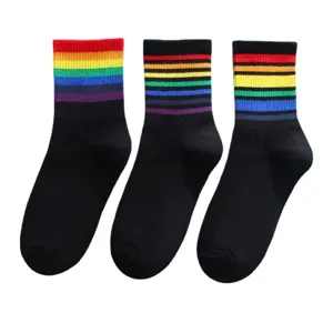 Women mid-tube socks featuring colorful rainbow striped cuffs, trendy casual hosiery.