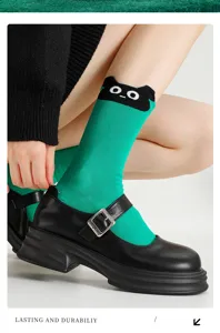 Green student long socks with cute cartoon cat design, breathable cotton casual hosiery.