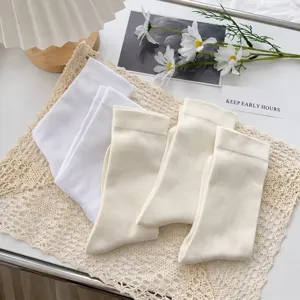 Women's summer thin solid color mid-tube socks Japanese style white slouch socks pair.