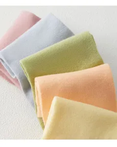 Detail shot of colorful solid women's short socks in soft pastel candy tones for summer.