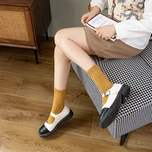 Comfortable solid color mid-calf cotton socks for women, warm winter thermal loop pile design.