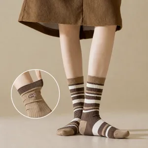 Women's brown striped crew socks, versatile stackable cozy hosiery for daily wear.