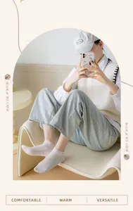 Detail view of breathable cotton short socks with cute bear pattern and stripes for women.