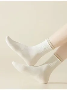 Close-up of ribbed mid-tube women socks, breathable cotton material, casual daily wear style.