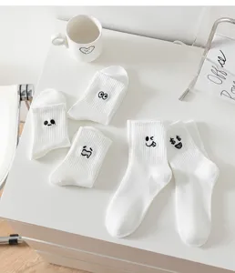 White mid-calf socks with cute funny embroidered expressions, soft cotton, casual daily wear.