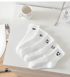 White mid-tube socks for women with funny embroidery expressions, casual and breathable.