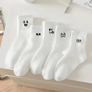 White mid-calf socks for women featuring funny embroidered expressions, cotton casual socks.