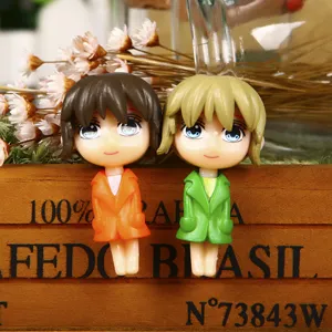 Detailed close-up view of cute anime cartoon girl keychain pendants, exquisite collectible chibi figures.