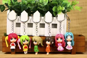 Cute anime cartoon girl keychains set, stylish metal key ring accessory for bags.
