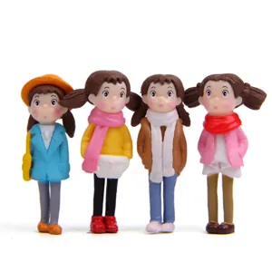 Cute winter scarf girl figurine detail for moss micro landscape and doll house decoration.