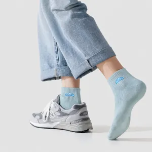 Men's breathable athletic crew socks with mountain pattern, perfect for casual and sports wear.