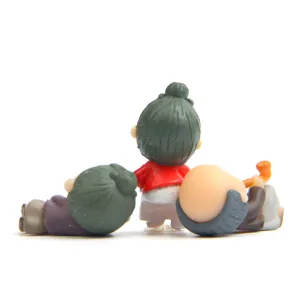 Miniature elderly couple figurines detail view for succulent landscaping and DIY decor.