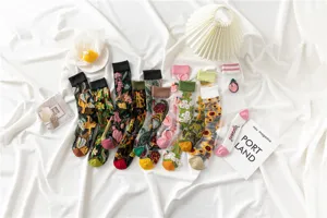 Sheer mesh floral embroidered mid-tube socks for women in breathable summer thin style.