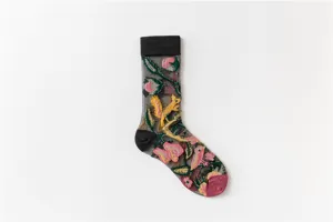 Detailed close-up view of sheer mid-tube socks showcasing exquisite 3D floral embroidery.