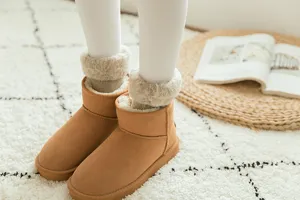 Detail shot of winter warm plush snow boots with cozy fleece lining and soft texture.