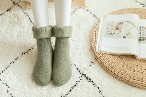 Thick fleece-lined thermal winter socks for women, cozy knitted snow boot socks detail view.