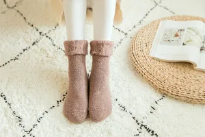 Cozy thick winter fleece-lined thermal knit socks for women, soft plush warm snow socks.