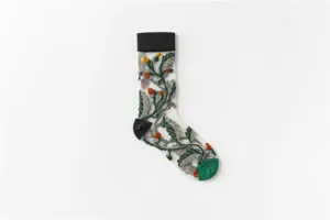 Detailed view of sheer mesh women crew socks with delicate green leaf and berry floral embroidery.