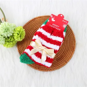 Cozy Christmas striped coral fleece socks for women, featuring a cute bow detail.