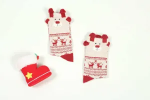 Closeup of Christmas mid-tube socks with 3D ears and cute reindeer snowflake patterns.