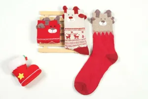 Detail view of Christmas socks with cute 3D bear ears, elk patterns, and cozy cotton fabric.