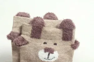 Cute cartoon bear plush ear knit socks detail view, soft and warm winter casual hosiery.