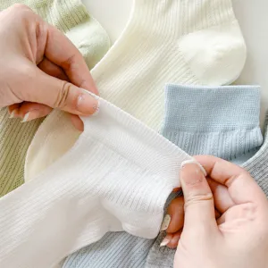 Detailed view of soft mesh short socks, stretchy fabric texture close-up display.