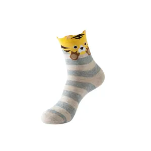 Cute cartoon tiger striped crew socks detail view, comfortable cotton fabric for women daily wear.