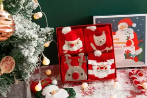 Christmas gift box with four pairs of cute 3D cartoon Santa and reindeer red mid-tube socks.
