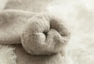 Close-up detail of thick fleece lined winter thermal wool socks with cozy plush interior.