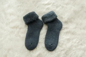 Thick warm wool snow socks for women, fleece-lined fuzzy winter thermal footwear detail.