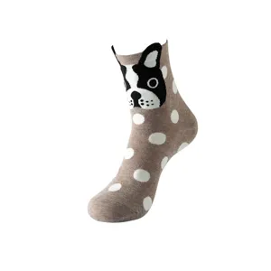 Detail shot of brown polka dot mid-calf sock with cute dog pattern knit design.