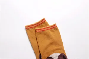 Cute cartoon dog pattern women cotton socks detail close-up, mustard mid tube design.