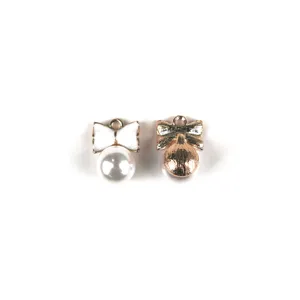 Detailed shot of DIY alloy bow pearl jewelry charms, elegant accessory for keychains.